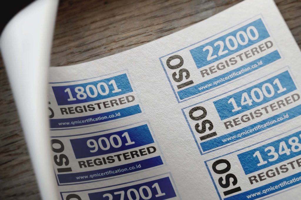 A close-up of ISO certification labels, including ISO 9001, 14001, and 22000, showcasing quality and compliance standards for businesses.